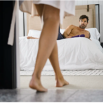 a man on a bed and a woman