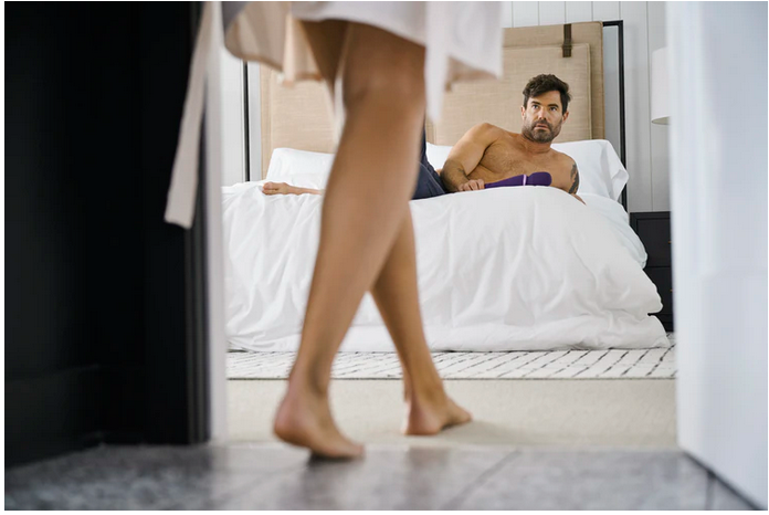 a man on a bed and a woman